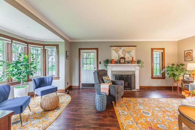 1674 Melrose Ave, Columbus, OH 43224 - living area with wood finished floors, a fireplace with flush hearth, crown molding, and baseboards