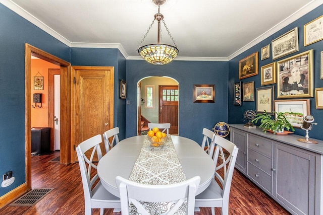 1674 Melrose Ave, Columbus, OH 43224 - dining space with arched walkways, dark wood-type flooring, ornamental molding, and baseboards