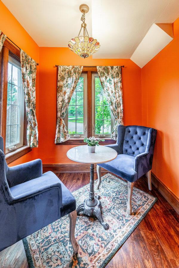 1674 Melrose Ave, Columbus, OH 43224 - living area featuring baseboards, wood finished floors, and vaulted ceiling