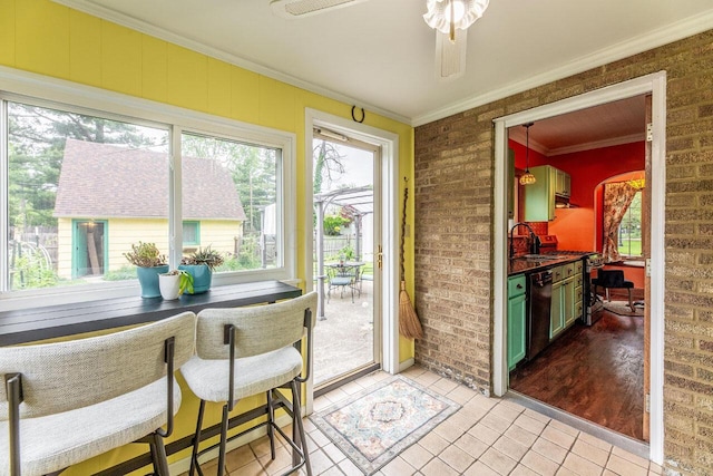 1674 Melrose Ave, Columbus, OH 43224 - sunroom / solarium featuring ornamental molding, a sink, tile patterned flooring, and brick wall