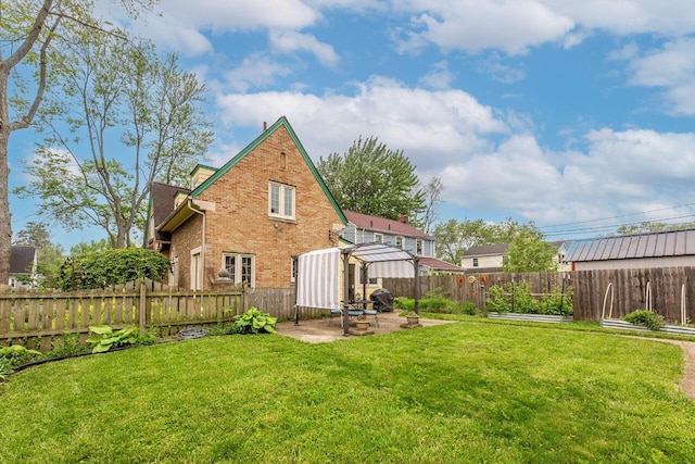 1674 Melrose Ave, Columbus, OH 43224 - rear view of property with brick siding and a patio