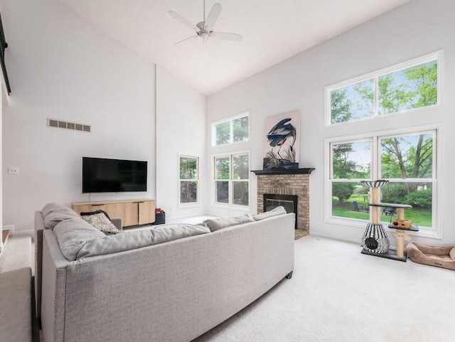 1249 Sea Shell Dr, Westerville, OH 43082 - living area featuring high vaulted ceiling, carpet floors, a ceiling fan, and a brick fireplace