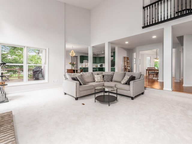1249 Sea Shell Dr, Westerville, OH 43082 - carpeted living area with a high ceiling and baseboards