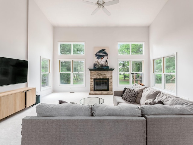 1249 Sea Shell Dr, Westerville, OH 43082 - living room with plenty of natural light, a brick fireplace, a ceiling fan, and light carpet