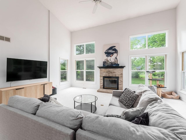 1249 Sea Shell Dr, Westerville, OH 43082 - living area with high vaulted ceiling, carpet flooring, a ceiling fan, and a brick fireplace