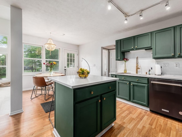 1249 Sea Shell Dr, Westerville, OH 43082 - kitchen with green cabinetry, dishwasher, light countertops, healthy amount of natural light, and a textured ceiling