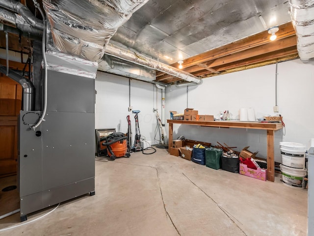 1249 Sea Shell Dr, Westerville, OH 43082 - unfinished below grade area with a workshop area, heating unit, and concrete block wall