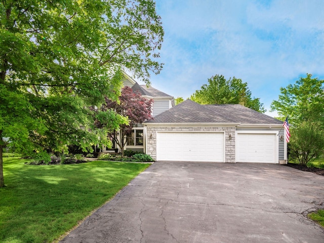 1249 Sea Shell Dr, Westerville, OH 43082 - view of front facade with driveway, stone siding, a front lawn, a garage, and roof with shingles