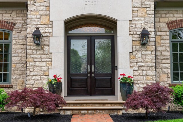 2060 Fontenay Pl, Upper Arlington, OH 43220 - property entrance with french doors and stone siding