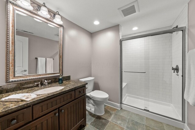 2060 Fontenay Pl, Upper Arlington, OH 43220 - full bath with a shower stall, toilet, vanity, stone finish floors, and baseboards
