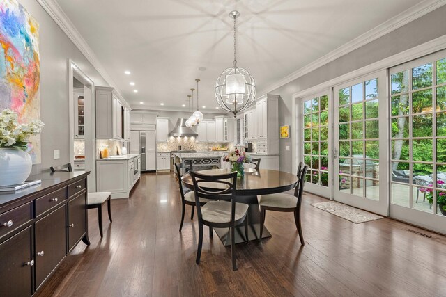 2060 Fontenay Pl, Upper Arlington, OH 43220 - dining space with a chandelier, healthy amount of natural light, crown molding, dark wood-type flooring, and recessed lighting