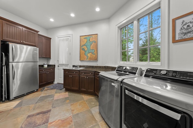 2060 Fontenay Pl, Upper Arlington, OH 43220 - laundry area with stone tile flooring, recessed lighting, and washing machine and dryer