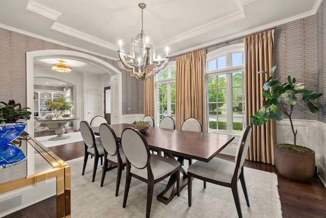 2060 Fontenay Pl, Upper Arlington, OH 43220 - dining area featuring a chandelier, wallpapered walls, ornamental molding, arched walkways, and wood finished floors
