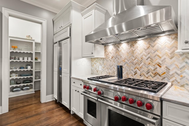 2060 Fontenay Pl, Upper Arlington, OH 43220 - kitchen featuring wall chimney exhaust hood, high end appliances, backsplash, white cabinetry, and crown molding