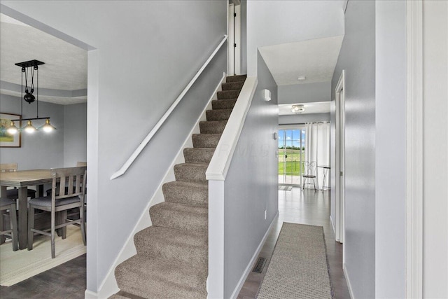 10746 State Route 287, Zanesfield, OH 43360 - stairs featuring baseboards and wood finished floors