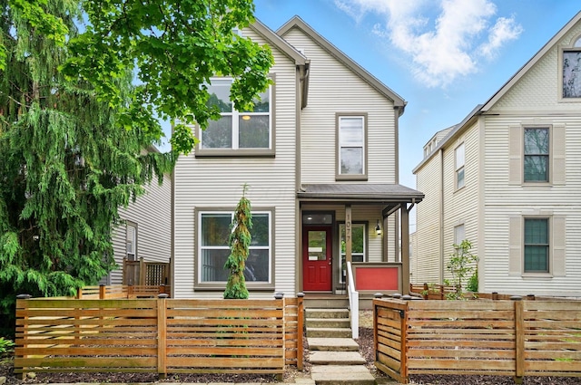 1077 Michigan Ave Unit 9, Columbus, OH 43201 - view of front of home featuring a porch and a fenced front yard