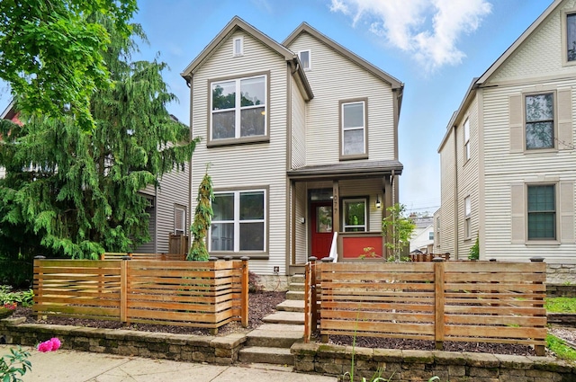 1077 Michigan Ave Unit 9, Columbus, OH 43201 - view of front of house featuring a fenced front yard and covered porch
