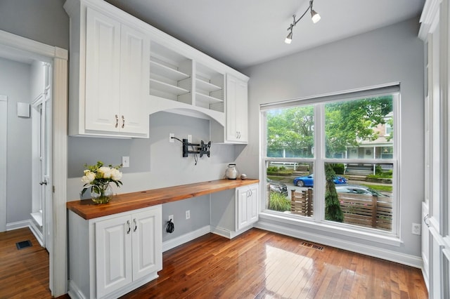 1077 Michigan Ave Unit 9, Columbus, OH 43201 - kitchen featuring wood counters, dark wood finished floors, and white cabinets