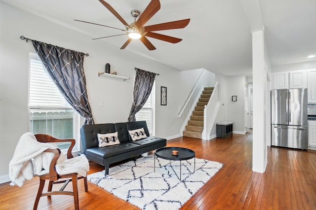 1077 Michigan Ave Unit 9, Columbus, OH 43201 - living room featuring ceiling fan, stairway, hardwood / wood-style floors, and baseboards
