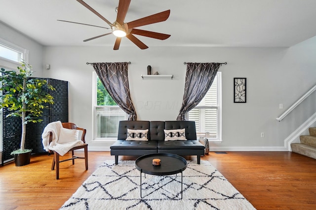 1077 Michigan Ave Unit 9, Columbus, OH 43201 - living area featuring a ceiling fan, stairway, wood finished floors, and baseboards