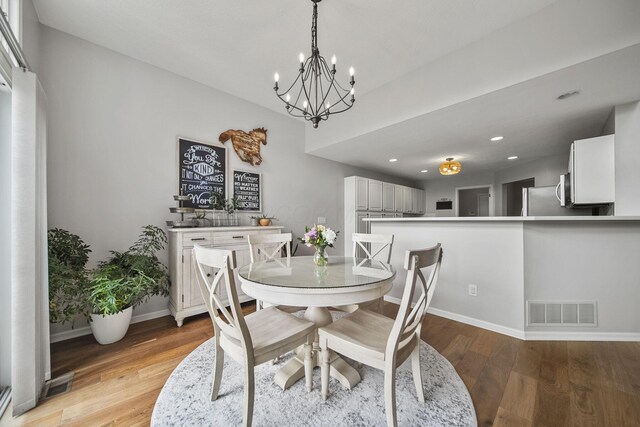 7257 Scioto Pkwy, Powell, OH 43065 - dining area featuring a chandelier, baseboards, light wood-type flooring, and recessed lighting