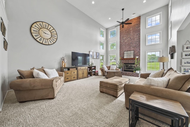 7257 Scioto Pkwy, Powell, OH 43065 - living room with a towering ceiling, ceiling fan, carpet flooring, a fireplace, and recessed lighting