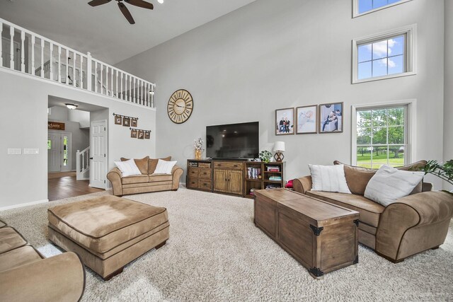 7257 Scioto Pkwy, Powell, OH 43065 - living area featuring a high ceiling, ceiling fan, carpet flooring, and baseboards