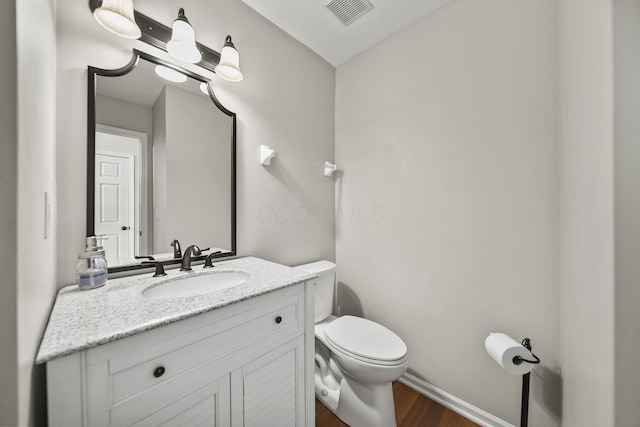 7257 Scioto Pkwy, Powell, OH 43065 - bathroom with wood finished floors, toilet, vanity, and baseboards