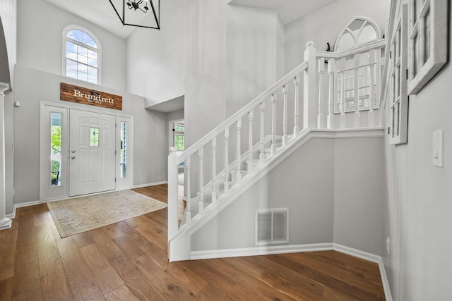 7257 Scioto Pkwy, Powell, OH 43065 - foyer entrance featuring hardwood / wood-style flooring, plenty of natural light, baseboards, and a high ceiling