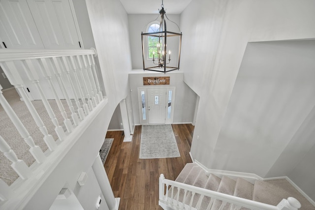 7257 Scioto Pkwy, Powell, OH 43065 - entryway with stairs, a chandelier, wood finished floors, baseboards, and a high ceiling