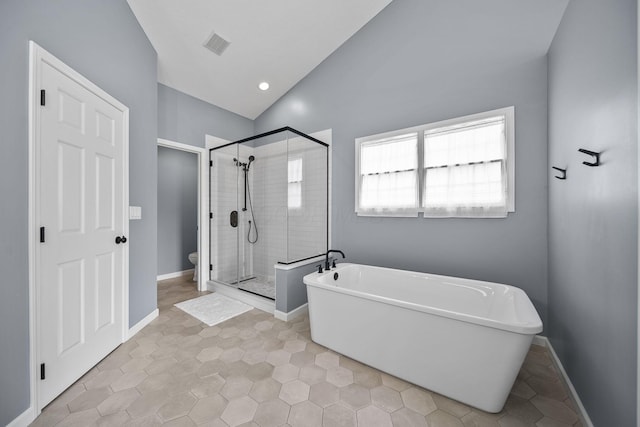 7257 Scioto Pkwy, Powell, OH 43065 - bathroom with vaulted ceiling, a stall shower, a soaking tub, toilet, and baseboards