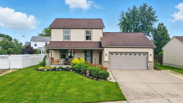 1407 Valley Dr, Marysville, OH 43040 - view of front of house featuring covered porch, stone siding, a garage, driveway, and roof with shingles