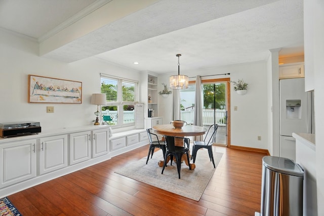 1407 Valley Dr, Marysville, OH 43040 - dining space with crown molding, hardwood / wood-style floors, a chandelier, and baseboards