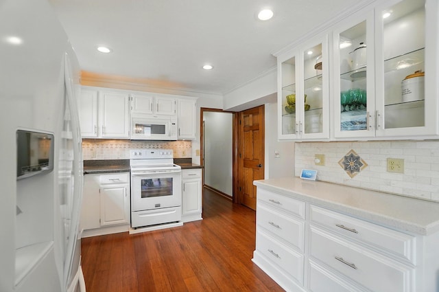 1407 Valley Dr, Marysville, OH 43040 - kitchen featuring white appliances, tasteful backsplash, white cabinets, dark wood-type flooring, and recessed lighting