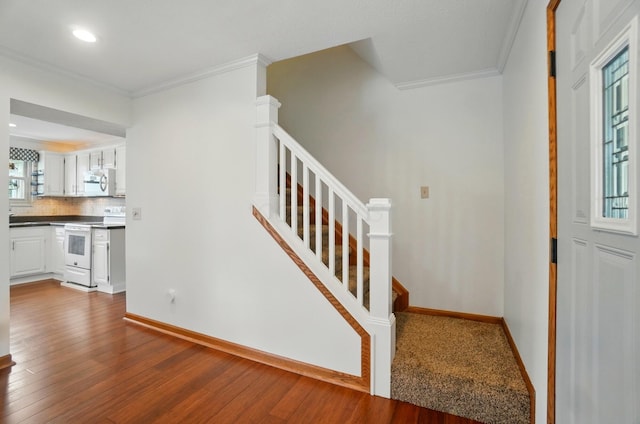 1407 Valley Dr, Marysville, OH 43040 - staircase with wood finished floors, ornamental molding, baseboards, and recessed lighting