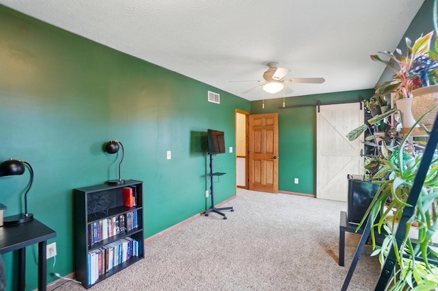 1407 Valley Dr, Marysville, OH 43040 - office with a barn door, carpet floors, ceiling fan, and baseboards