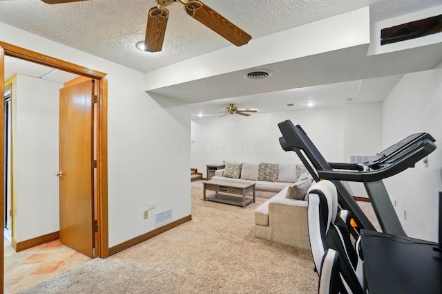 1407 Valley Dr, Marysville, OH 43040 - exercise room with ceiling fan, baseboards, a textured ceiling, and light colored carpet