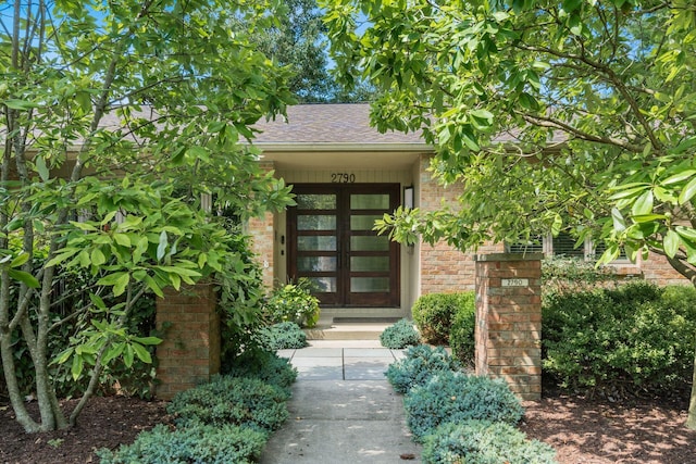 2790 Alliston Ct, Columbus, OH 43220 - property entrance featuring brick siding, a shingled roof, and french doors