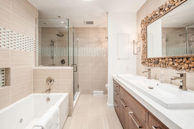 2790 Alliston Ct, Columbus, OH 43220 - full bathroom featuring a garden tub, vanity, a shower stall, toilet, and tile walls