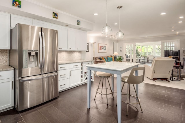 2790 Alliston Ct, Columbus, OH 43220 - kitchen with stainless steel refrigerator with ice dispenser, recessed lighting, crown molding, tasteful backsplash, and open floor plan