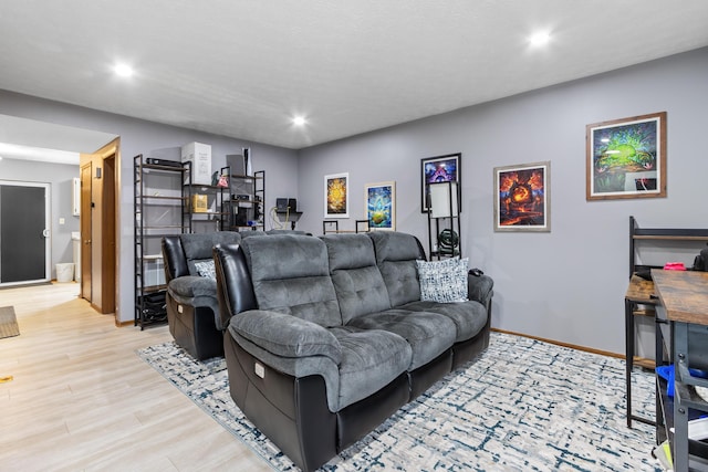 living area featuring light wood finished floors, recessed lighting, and baseboards
