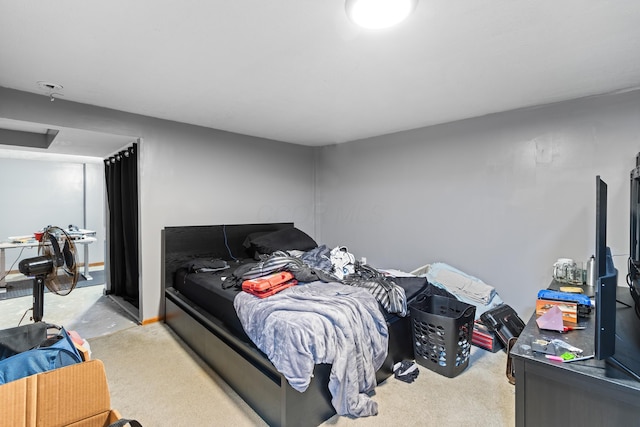 bedroom featuring light colored carpet