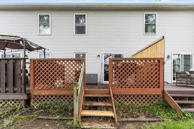 back of property featuring a deck