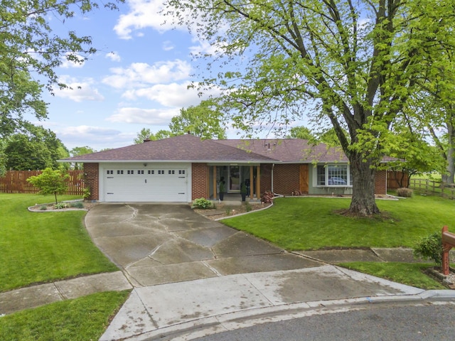 single story home with brick siding, a garage, and concrete driveway