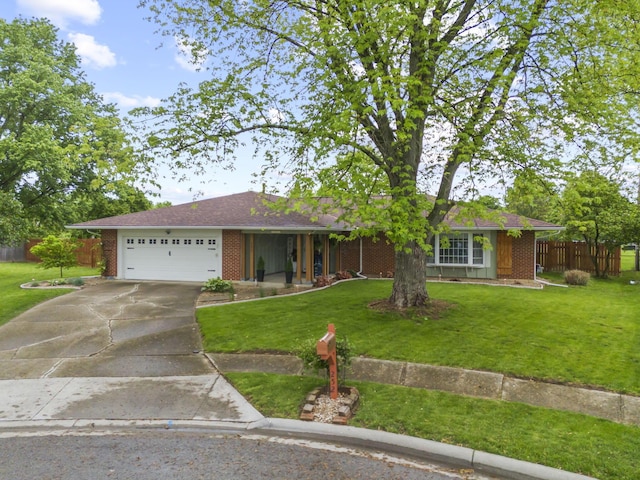 ranch-style house with brick siding, driveway, and an attached garage