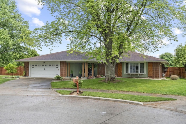 single story home featuring driveway, an attached garage, and brick siding