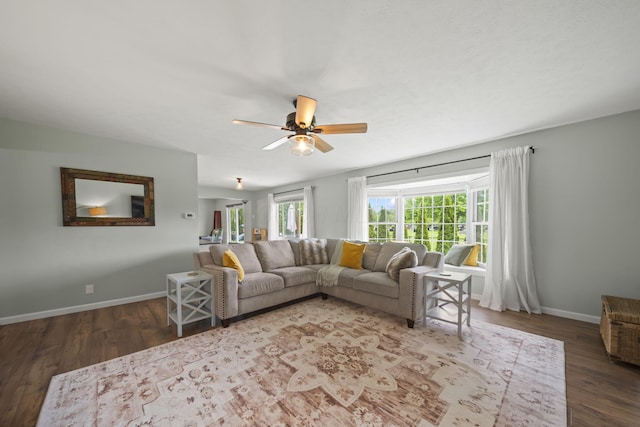 living room with ceiling fan, wood finished floors, and baseboards
