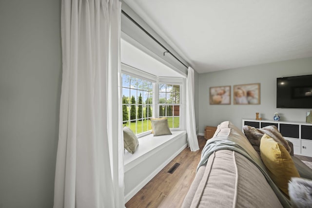living room with wood finished floors and baseboards