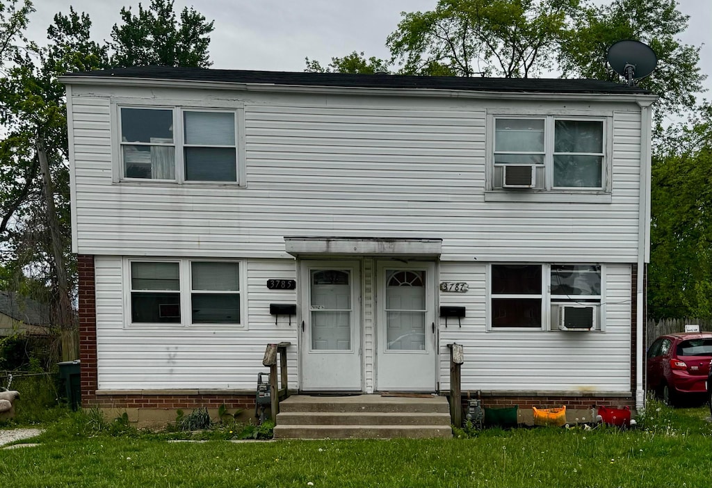 3785 Briggs Rd Unit 3785, Columbus, OH 43228 - view of front facade with a front lawn and cooling unit
