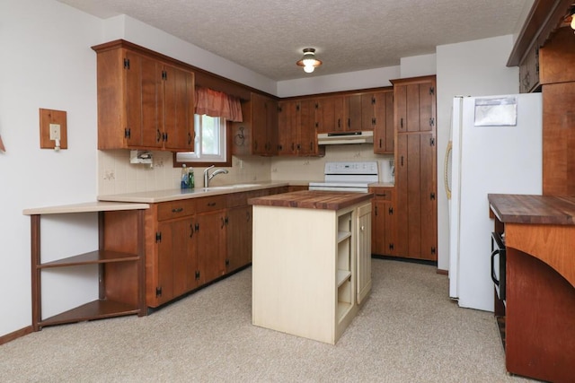 1294 Kings Corners Rd E, Mansfield, OH 44904 - kitchen featuring range, under cabinet range hood, open shelves, freestanding refrigerator, and decorative backsplash